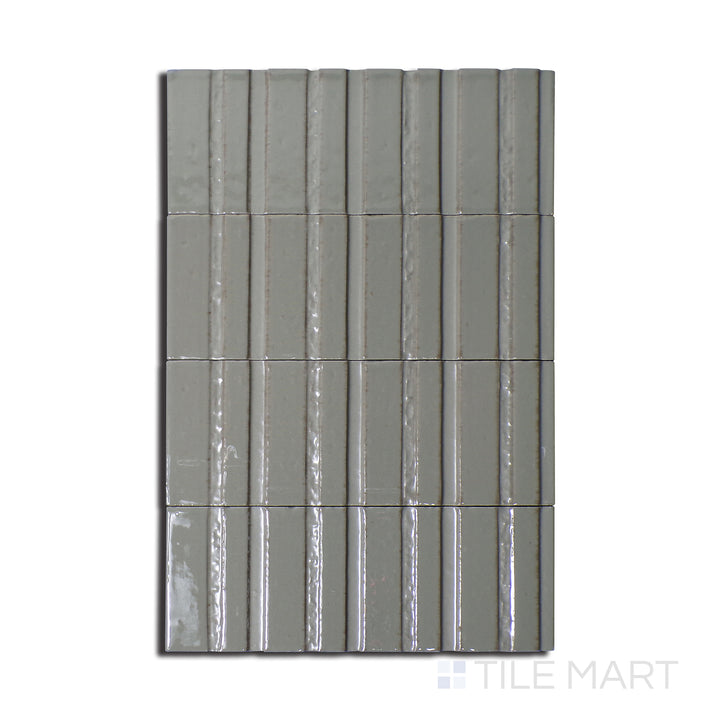 Top-down perspective of Glace Muschio 3X8 Glossy Porcelain, a subtle green tile with a high-shine glossy texture, adding a refreshing feel to spaces.