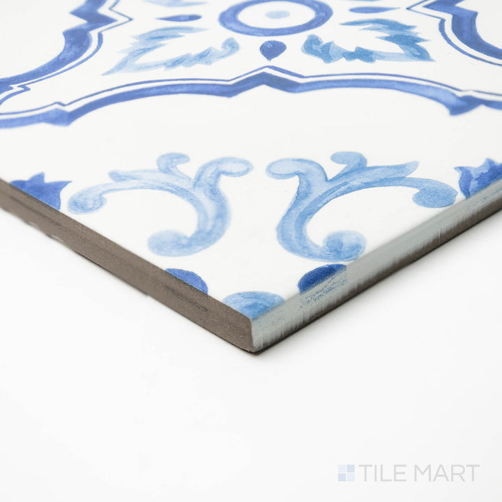 Angled view of Mestral Cross 9x9 matte porcelain tile, presenting its geometric styling, matte surface, and the sharp, well-crafted corner where edges meet.