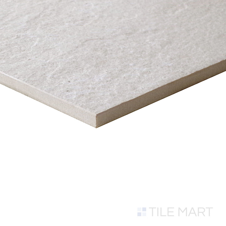 A refined natural texture is showcased in this close-up of Motley Rio 12x24 matte porcelain tile, capturing its smooth matte surface and organic color variations.