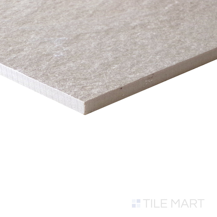 A warm neutral hue with a fine matte texture is displayed in this close-up of Motley Wembley 12x24 matte porcelain tile, highlighting its refined and natural aesthetic.