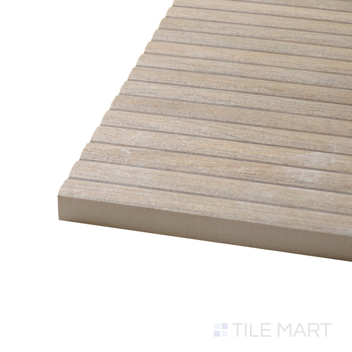 Corner shot of Ribbon Wood Camel 12.4X39.4 Matte Ceramic Tile, showcasing its warm camel wood tones with a realistic grain pattern and soft matte finish.