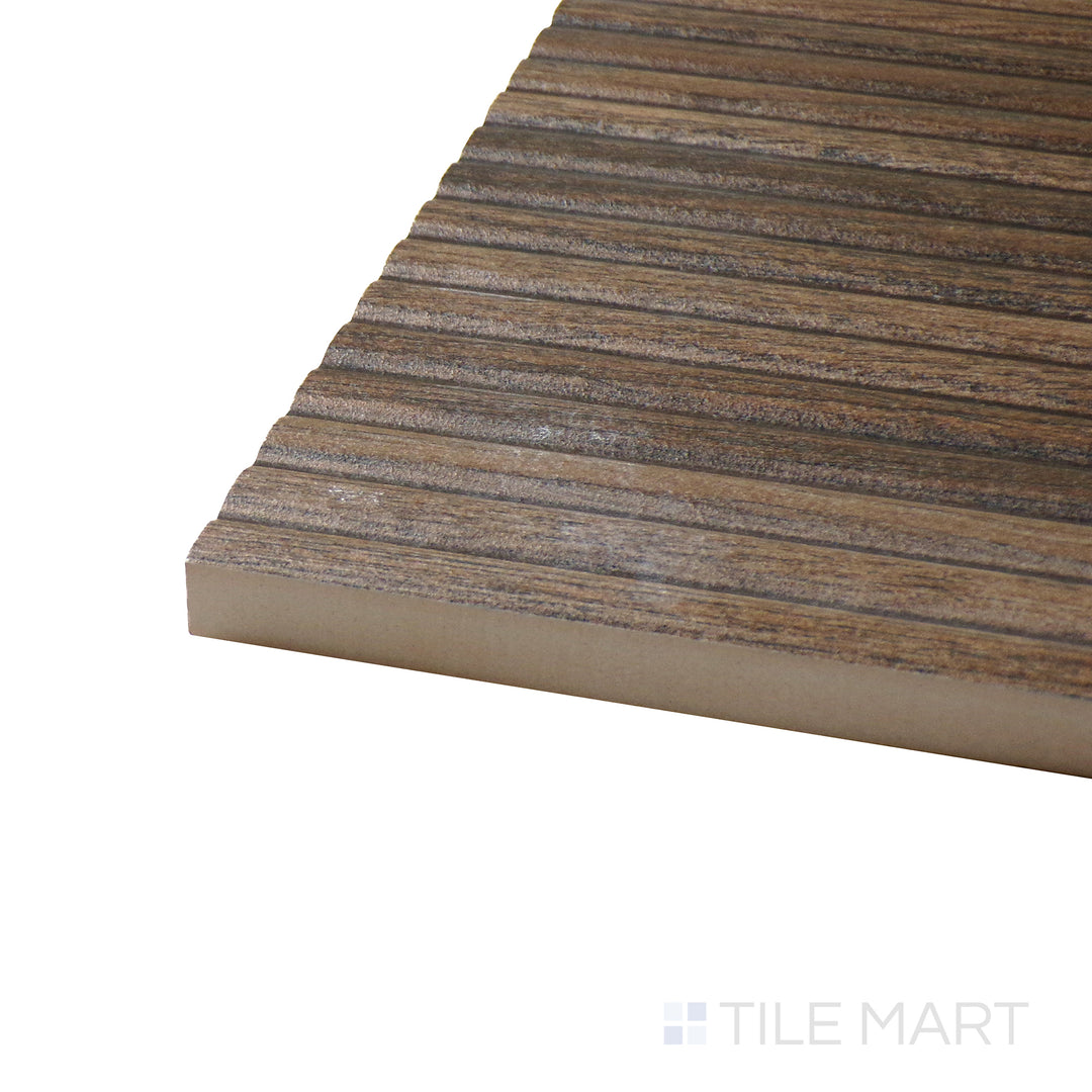 Angled view of Ribbon Wood Coffee 12.4X39.4 Matte Ceramic Tile, highlighting its deep coffee brown hues with natural wood-like textures in a matte surface.