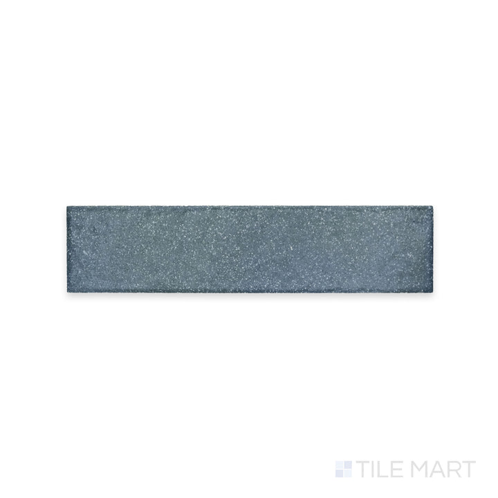 A rich blue hue with a soft matte finish is showcased in this close-up of Tetris Blu 2x8 matte porcelain tile, offering a bold yet sophisticated appeal.