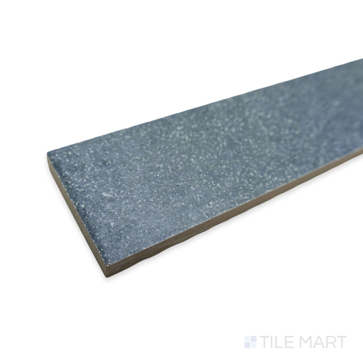 Corner shot of Tetris Blu 2x8 matte porcelain tile, showcasing its rich blue tone, crisp edges, and how its matte texture absorbs light to create a soft, even finish.