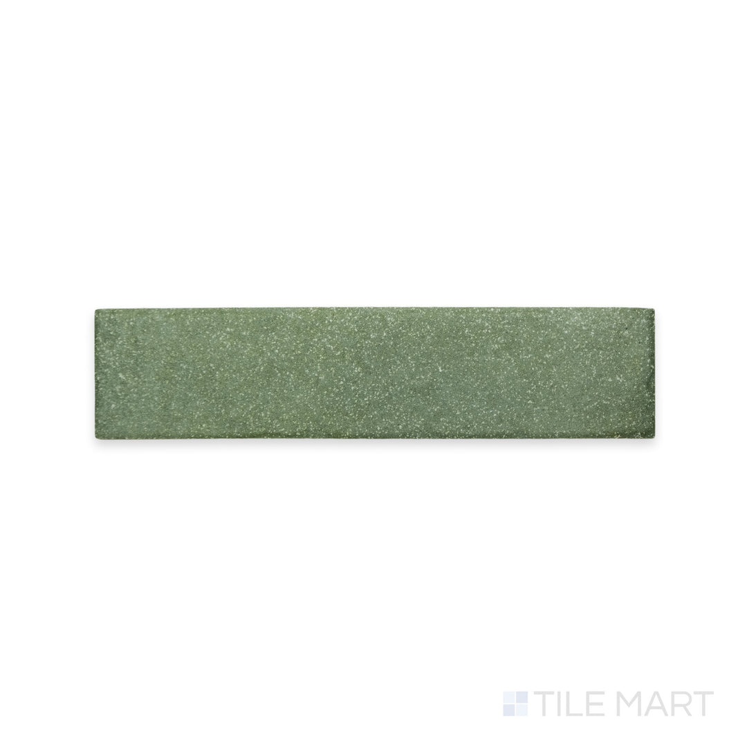 A delicate green shade with a fine matte texture is displayed in this detailed macro shot of Tetris Muschio 2x8 matte porcelain tile, adding a fresh and natural feel.