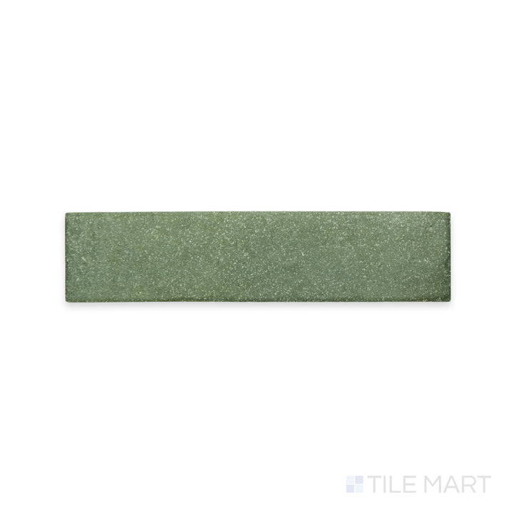 A delicate green shade with a fine matte texture is displayed in this detailed macro shot of Tetris Muschio 2x8 matte porcelain tile, adding a fresh and natural feel.