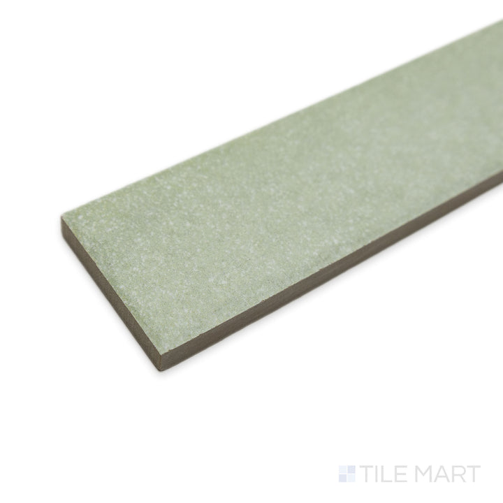 Angled perspective of Tetris Rugiada 2x8 matte porcelain tile, emphasizing its subtle grey hue, fine surface texture, and sharp, well-defined corner formation.