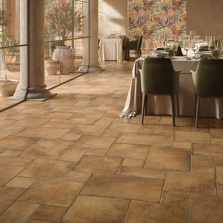 A warm and rustic elegance elevates the setting with the natural charm of Valdorcia Ocra Versailles Pattern Matte Porcelain.