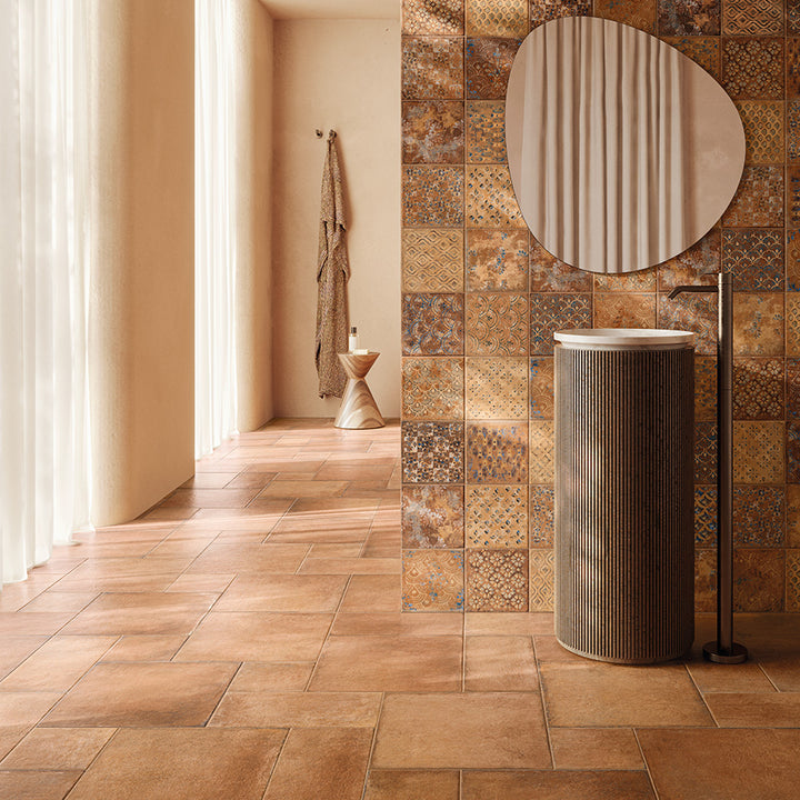 A sophisticated interior showcasing Valdorcia Terracotta Versailles Pattern Matte Porcelain, adding depth and character with its rich, sun-kissed hues and dynamic pattern.