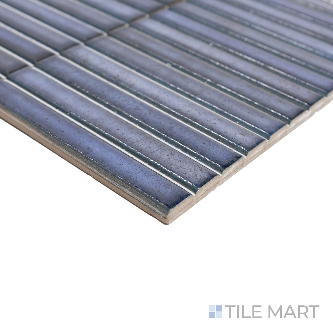 Angled side view of Karatsu Midnight 4.5x9 matte porcelain tile, featuring its deep charcoal hue, fine matte texture, and sharp corner intersection.