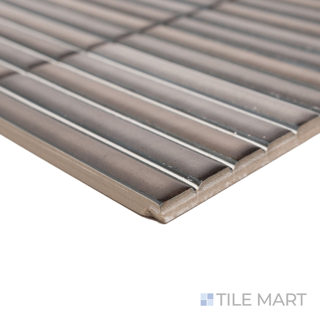 Corner-focused shot of Karatsu Charcoal 4.5x9 matte porcelain tile, emphasizing its bold, dark finish, structured cut, and seamless edge connection.