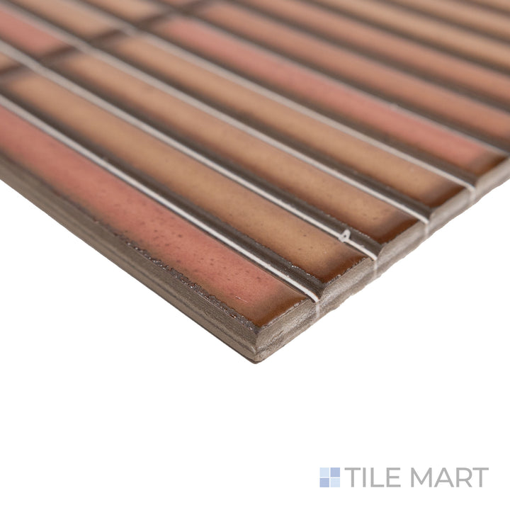 Angled close-up of Karatsu Rusty 4.5x9 matte porcelain tile, capturing its rich terracotta hue, sharp edge details, and the smooth matte texture that softens its warm tones.