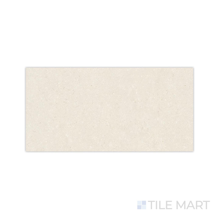 A smooth matte texture with warm coral undertones is detailed in this close-up of Pietra Coral Natural 24x48 matte porcelain tile, offering a soft and inviting appeal.