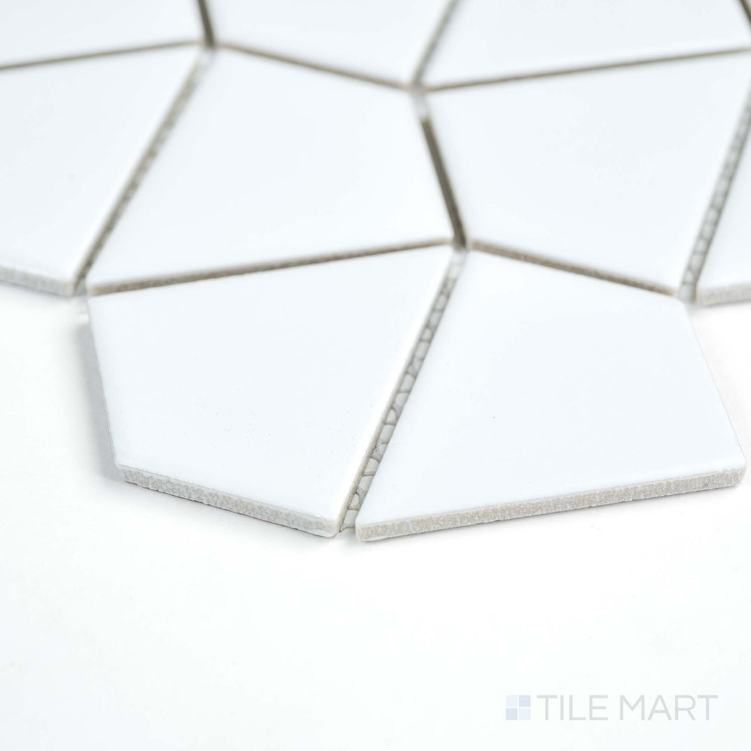 Seen from the side, this white Dragonscale mosaic tile showcases delicate porcelain scales with a matte sheen.