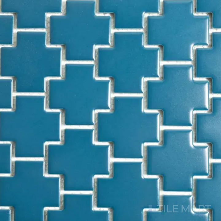 Overhead shot of Porcelain Glazed Mosaics Blue Cross Matte, a striking blue-toned tile with a geometric cross pattern in a soft matte finish.