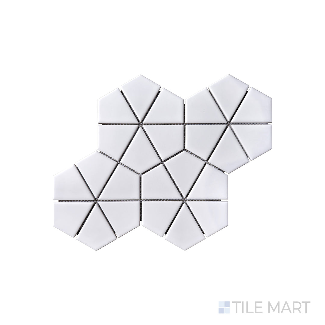 A bright and crisp white hexagonal kaleidoscope pattern is captured in this macro shot of Porcelain Glazed Mosaics White Kaleido Hex matte tile, creating a bold statement.