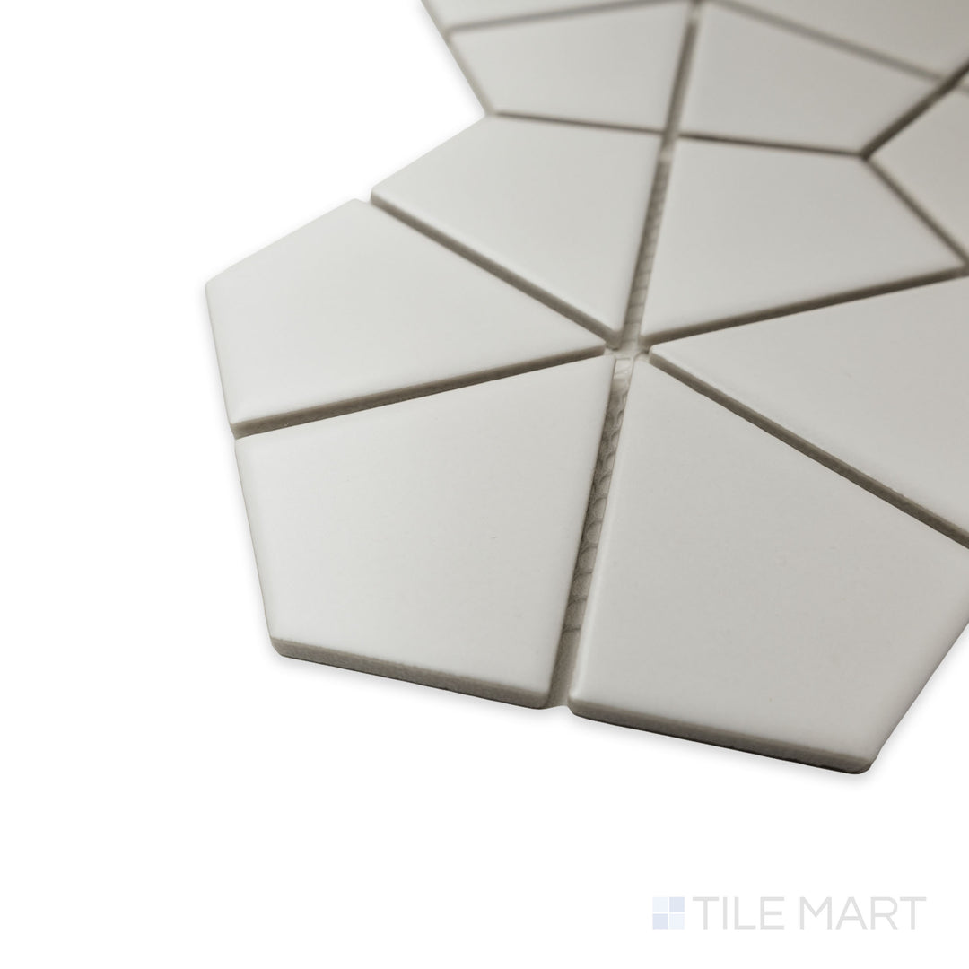 Corner perspective of Porcelain Glazed Mosaics White Kaleido Hex Matte tile, emphasizing the geometric pattern, precise cut, and the way light softly interacts with its matte texture.