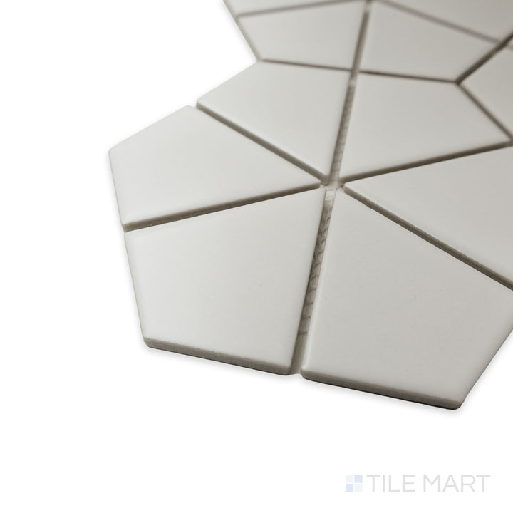Corner perspective of Porcelain Glazed Mosaics White Kaleido Hex Matte tile, emphasizing the geometric pattern, precise cut, and the way light softly interacts with its matte texture.