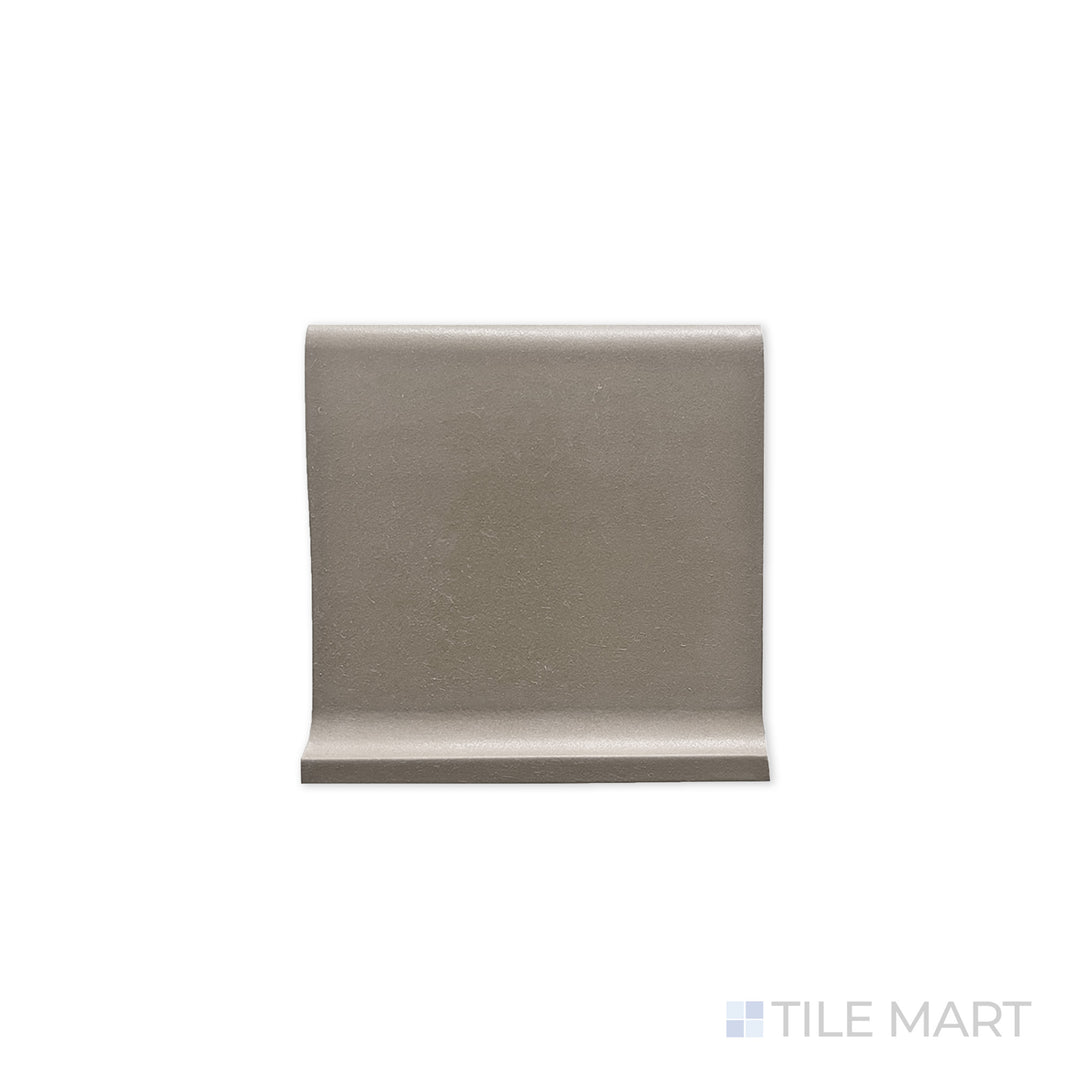 Flat-lay image of Quarry + Gray 6X6 Matte Ceramic Cove Base, a neutral gray tile designed for base transitions with a matte surface for a seamless look.