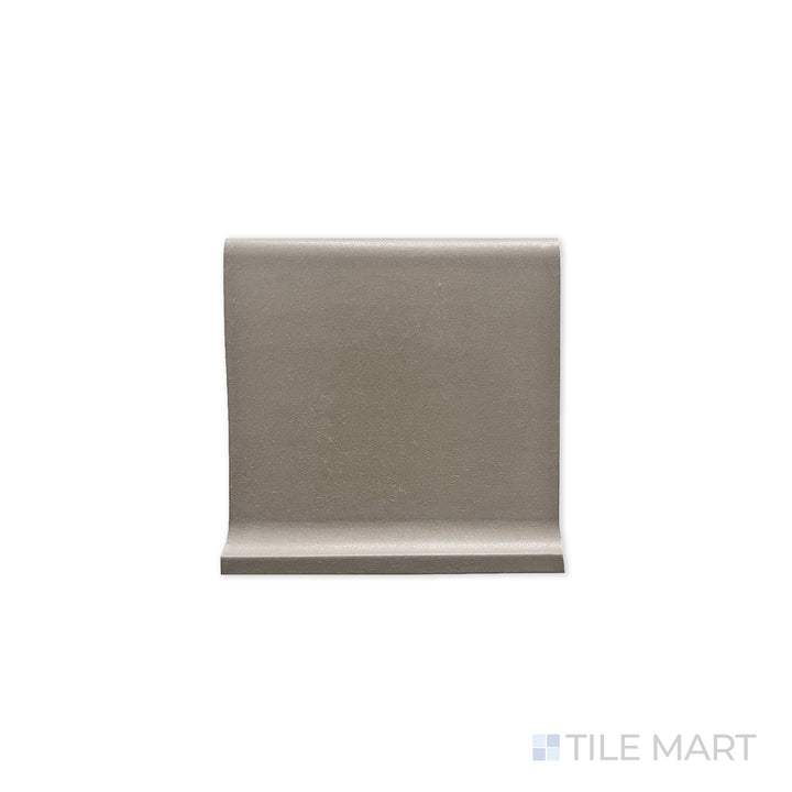 Flat-lay image of Quarry + Gray 6X6 Matte Ceramic Cove Base, a neutral gray tile designed for base transitions with a matte surface for a seamless look.