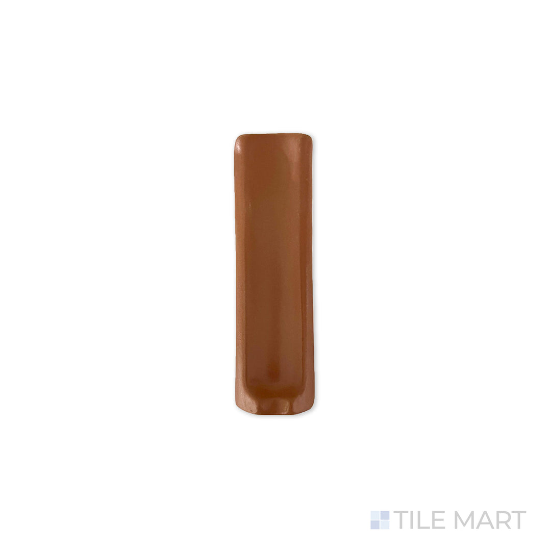 Overhead shot of Quarry + Red 1X6 Matte Ceramic Inside Corner, a compact tile piece with a matte texture, designed for interior edge detailing.