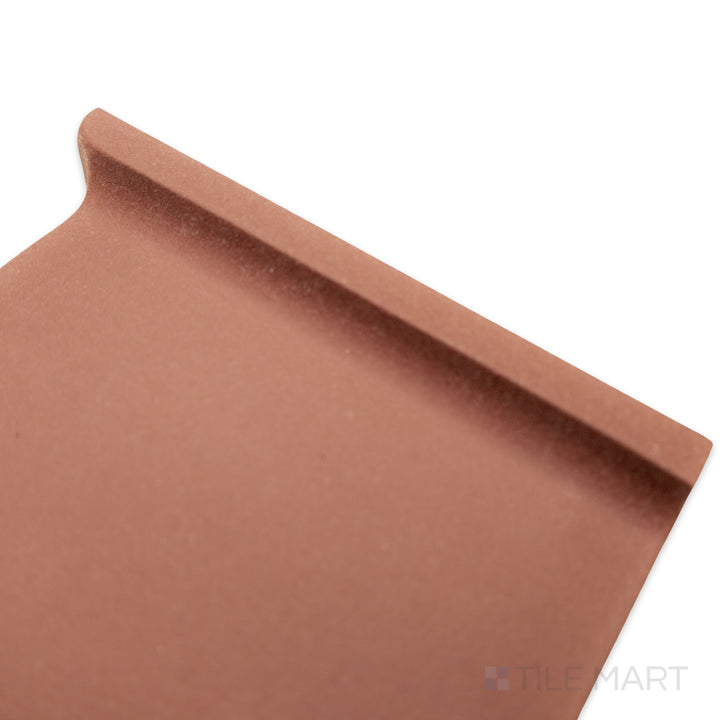 Angled corner shot of Quarry + Red 6x6 matte ceramic outside corner left, featuring a warm red shade with a precise corner cut and matte surface.