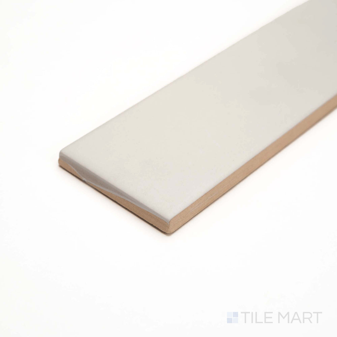From the side, this Glenbrook Blank Canvas tile reveals a smooth matte ceramic in a minimalist cream shade.