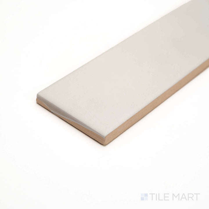 From the side, this Glenbrook Blank Canvas tile reveals a smooth matte ceramic in a minimalist cream shade.