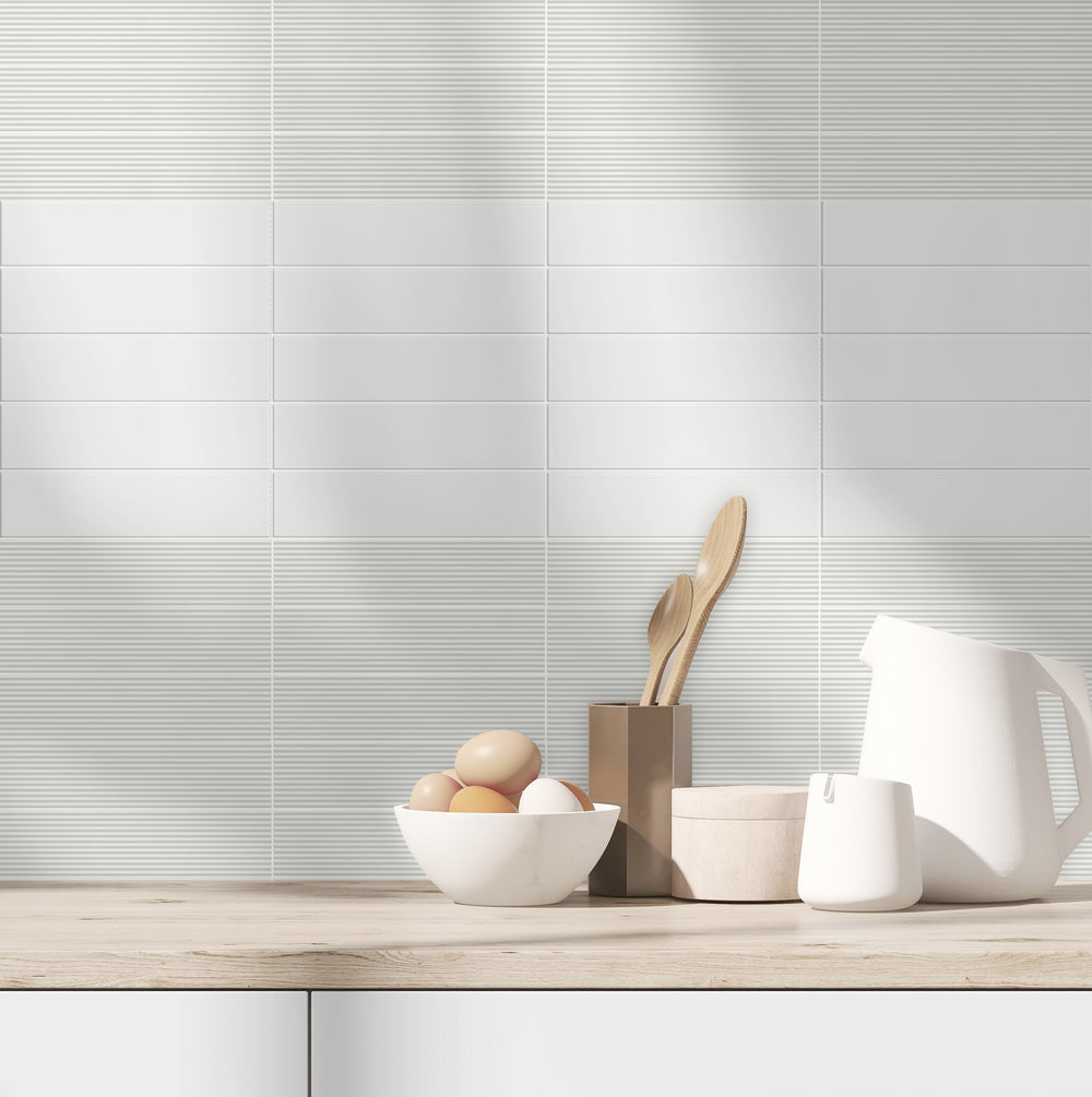 A neutral and adaptable tone creates a seamless backdrop, highlighted by Glenbrook Blank Canvas 2X8 Matte Ceramic.