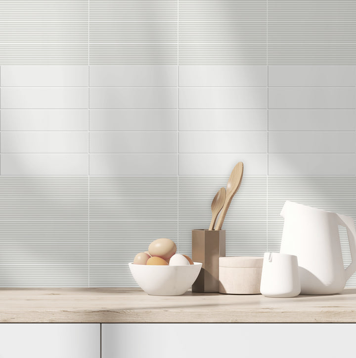 A neutral and adaptable tone creates a seamless backdrop, highlighted by Glenbrook Blank Canvas 2X8 Matte Ceramic.