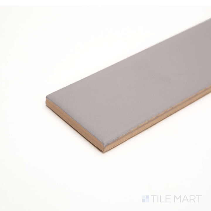 This angled shot shows Glenbrook Rustic Greige’s muted, earthy matte ceramic surface.