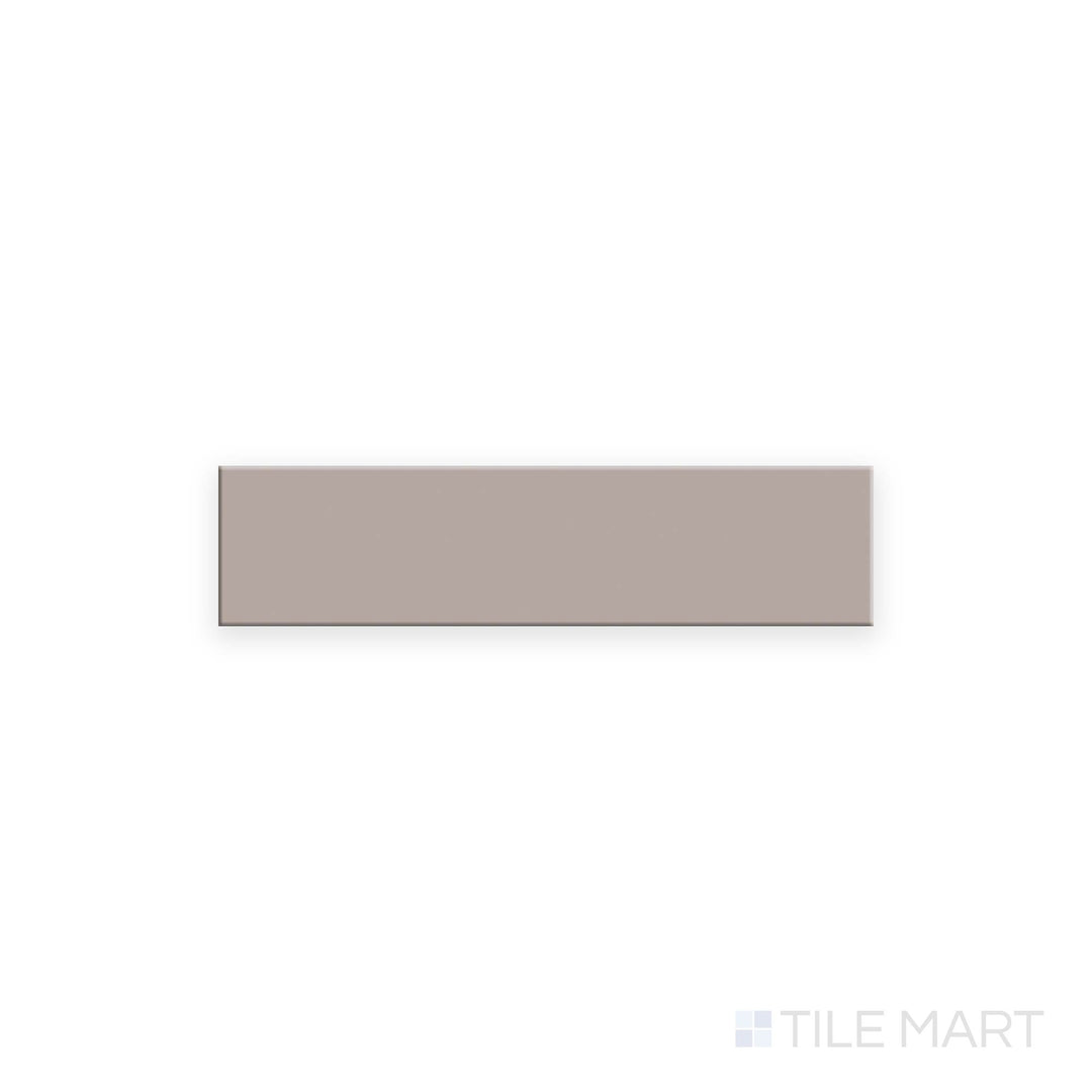 Top-down shot of Glenbrook Redend Point 2x8 flat matte ceramic tile, highlighting a soft reddish clay tone with a flat, non-reflective surface.