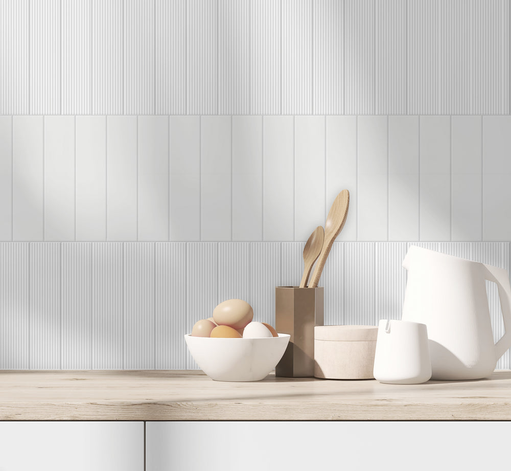 A crisp, clean tone enhances any space, featuring Glenbrook Polar White 2X8 Matte Ceramic.