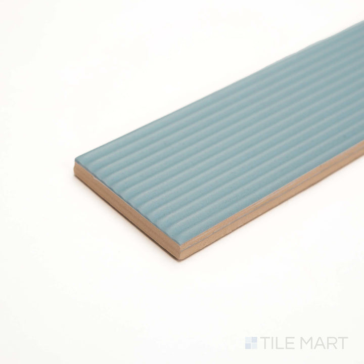 Corner view of Glenbrook Quiet Moments striped tile reveals refined texture in a tranquil gray tone.