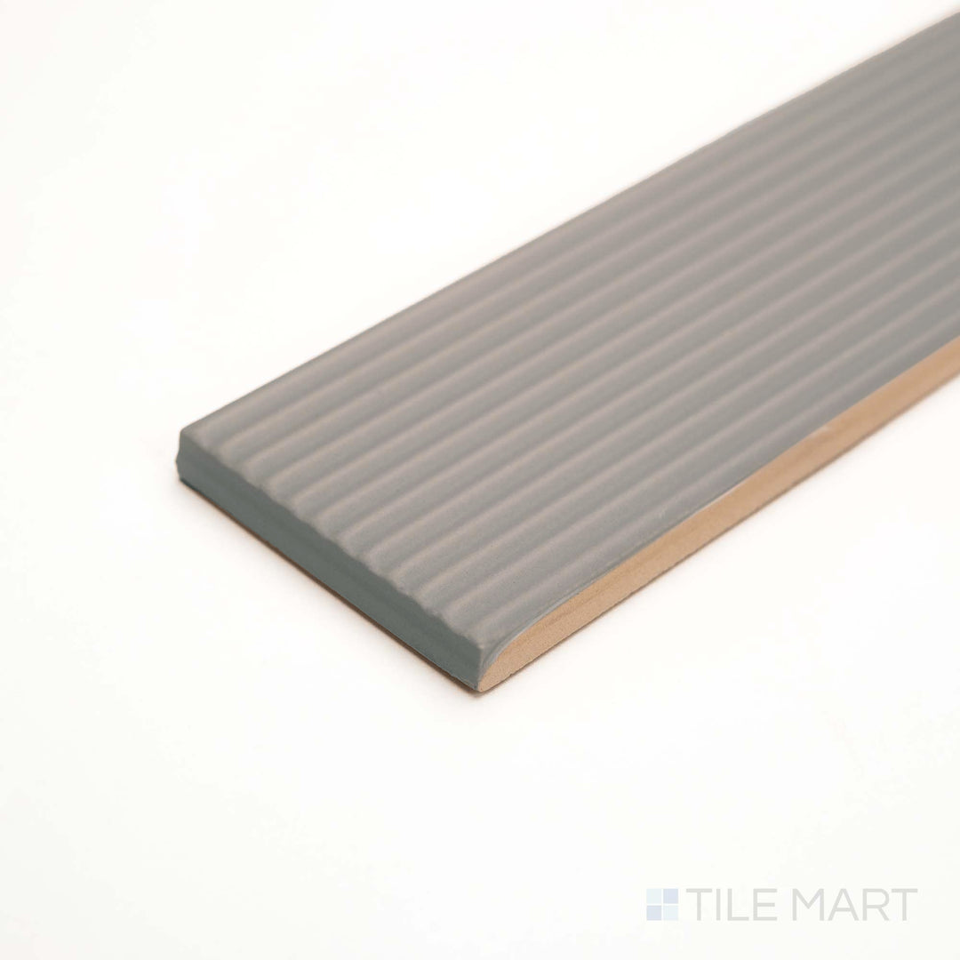 Subtle striping in Rustic Greige brings dimension to this matte ceramic, seen in an angled shot.