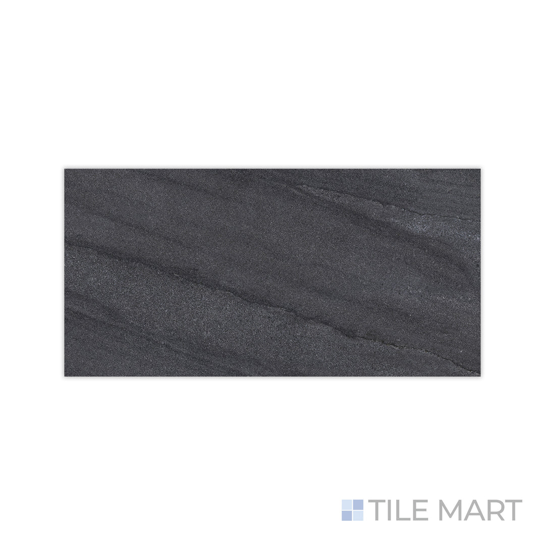 The rugged appeal of Origin Boulder 24x48 matte porcelain tile is captured in this close-up shot, showcasing its deep, stone-inspired hues and refined matte finish.