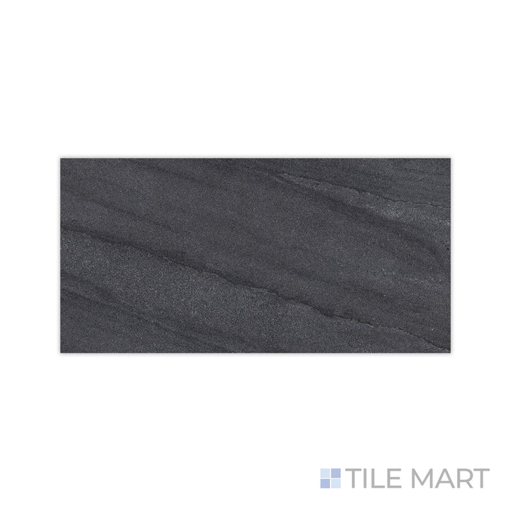 The rugged appeal of Origin Boulder 24x48 matte porcelain tile is captured in this close-up shot, showcasing its deep, stone-inspired hues and refined matte finish.