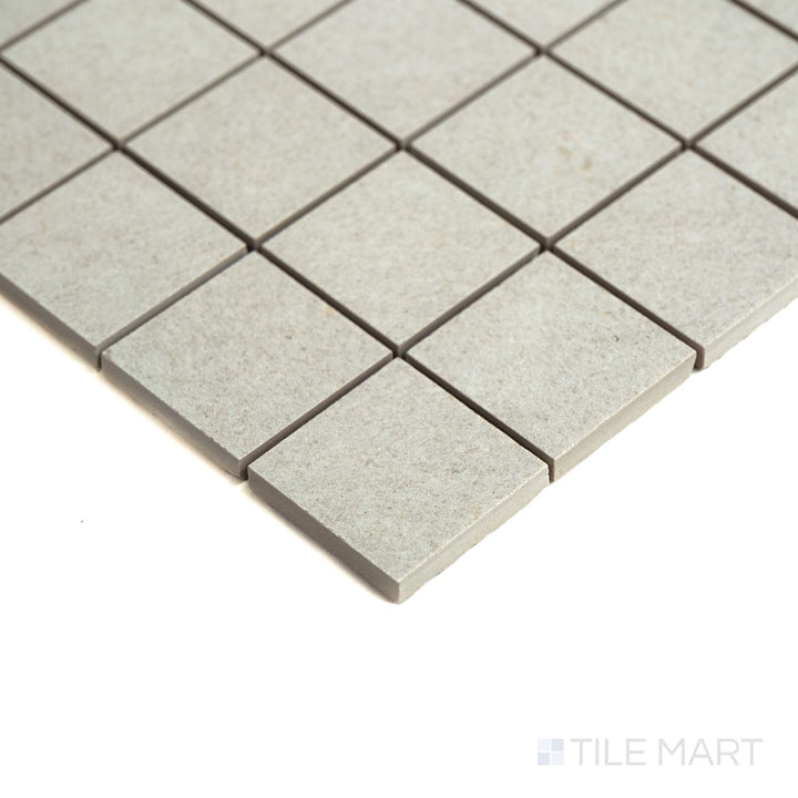 Corner angle reveals the grid layout of Origin Arctic 2" mosaic, showcasing its crisp white tiles and smooth matte finish.