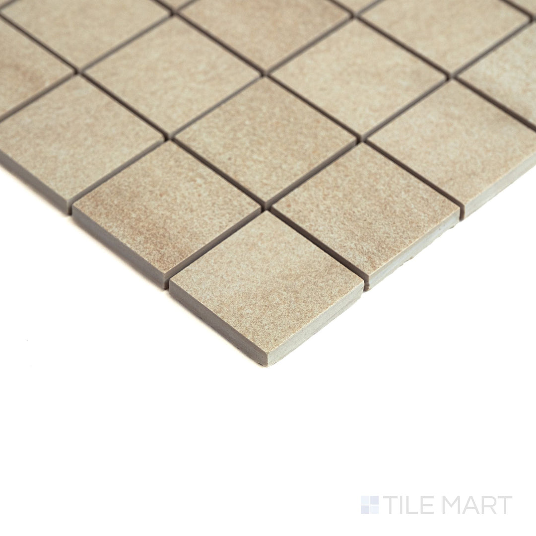 Side view of Origin Desert 2" mosaic highlights the warm beige tones and clean grout lines across the matte surface.