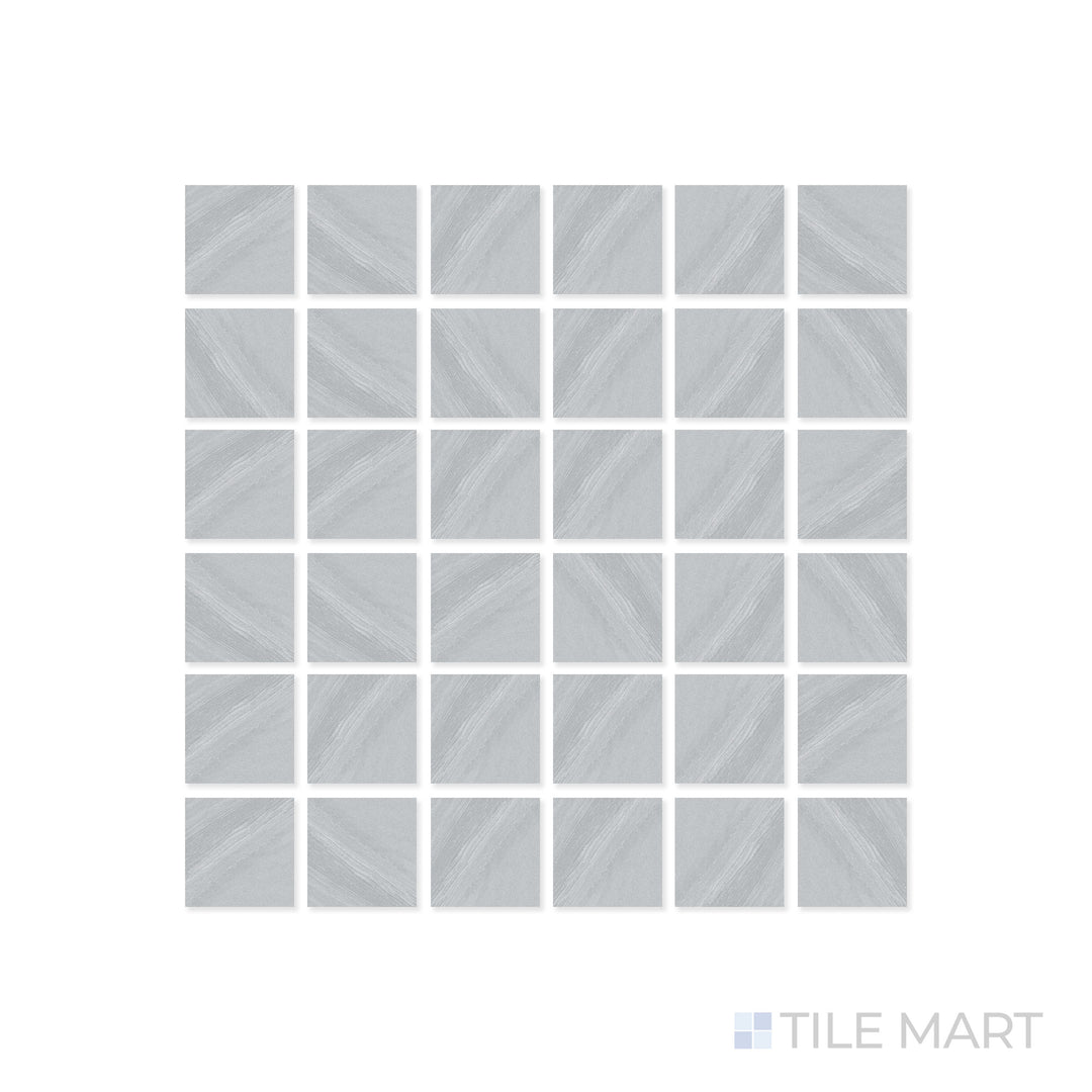 A close-up of Origin Canyon 2" Square matte porcelain mosaic tile reveals its intricate grid layout and earthy neutral hues, complementing its smooth matte surface.