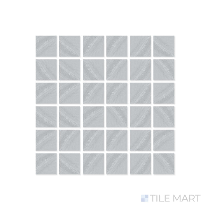 A close-up of Origin Canyon 2" Square matte porcelain mosaic tile reveals its intricate grid layout and earthy neutral hues, complementing its smooth matte surface.