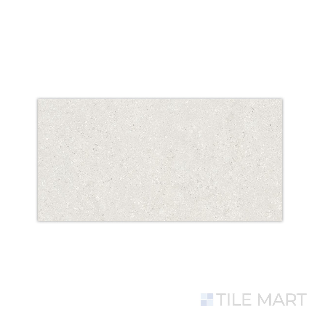 A soft and muted pearl hue with a smooth matte surface is displayed in this macro shot of Pietra Coral Pearl 24x48 matte porcelain tile, ideal for modern interiors.