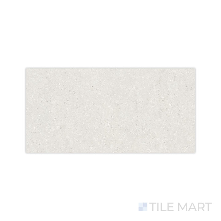A soft and muted pearl hue with a smooth matte surface is displayed in this macro shot of Pietra Coral Pearl 24x48 matte porcelain tile, ideal for modern interiors.