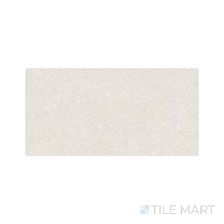 A detailed close-up of Pietra Coral Sand 24x48 matte porcelain tile highlights its fine-grain surface and natural earthy tone, perfect for creating a warm and inviting space.