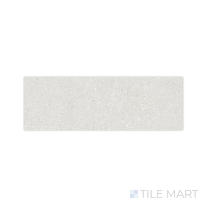 A smooth pearl-toned surface with a delicate matte finish is highlighted in this close-up of Pietra Coral Pearl 12x36 matte porcelain tile, offering a subtle and elegant look.