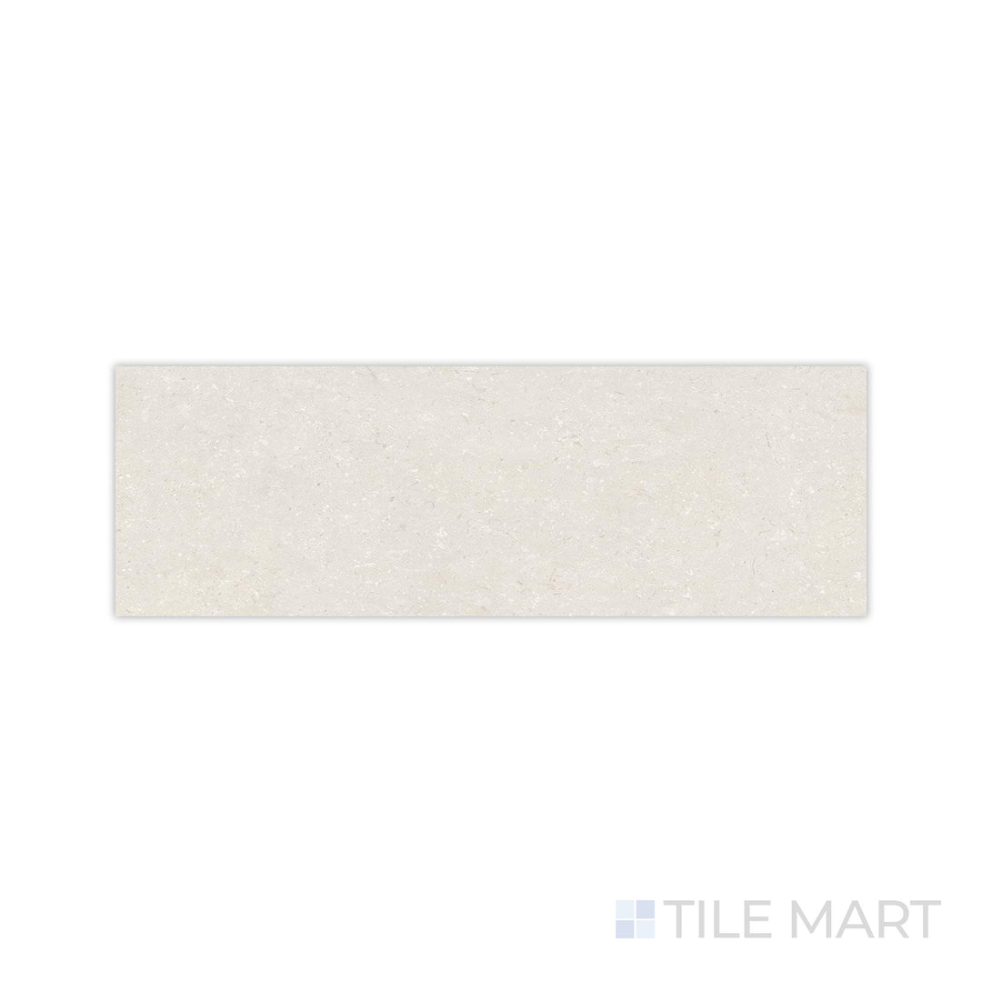 A warm sandy tone with a soft matte finish is displayed in this close-up of Pietra Coral Sand 12x36 matte porcelain tile, emphasizing its organic and refined feel.