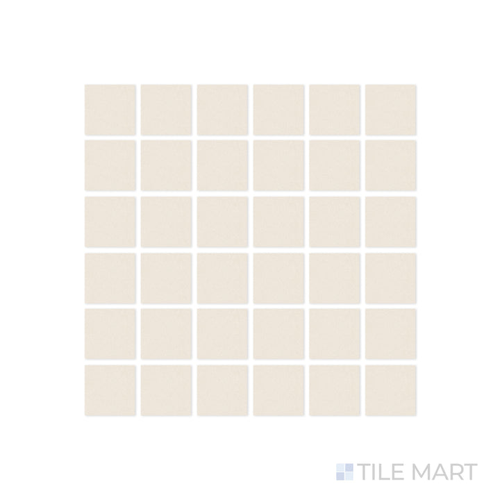 A close-up of Pietra Coral Natural 2" Square matte porcelain mosaic tile highlights its intricate layout and raw natural texture, creating a seamless organic effect.