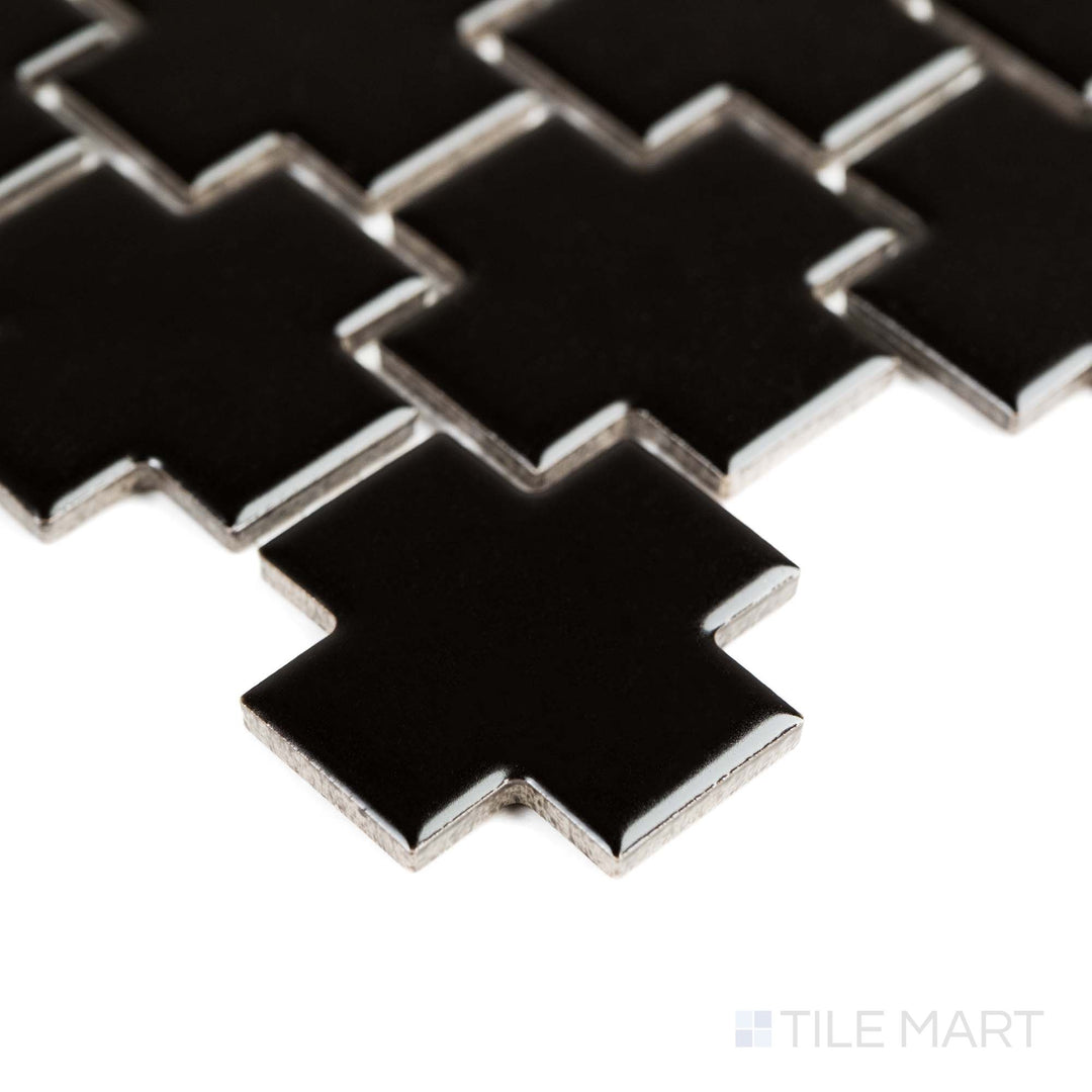 This corner angle displays the bold look of Black 2" Cross matte porcelain mosaic with sharp contrast and deep tone.