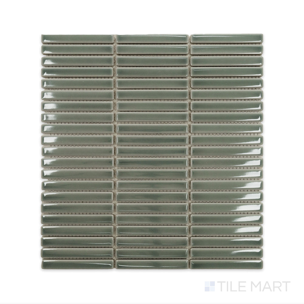 A close-up perspective of Porcelain Glazed Mosaics Aged Grey Mini Sticks Glossy tile highlights its elegant, weathered texture with a smooth reflective finish for added depth.