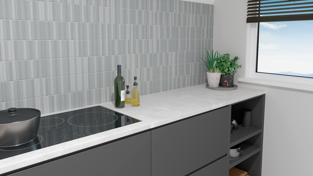 A sophisticated and contemporary touch defines the space, enriched by Roku Grey 4.5X9 Matte Porcelain.